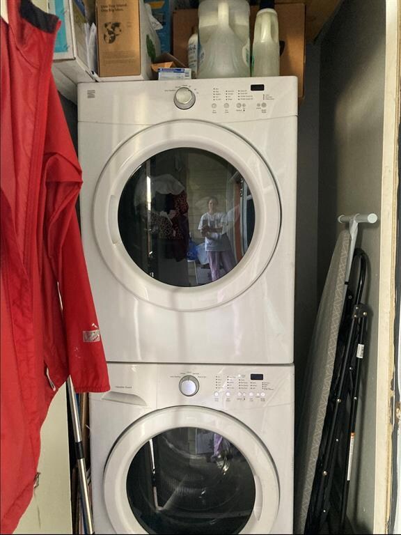 Laundry area featuring stacked washer / drying ma