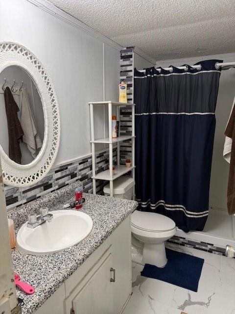 Bathroom with a stall shower, vanity, ornamental molding, a textured ceiling, and light marble finish flooring