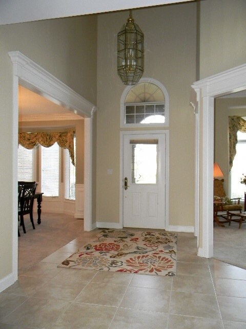 2 story foyer with tiled flooring