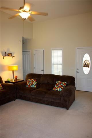 High ceilings in living room give this home a spacious and open feel.