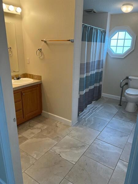 Master bathroom with roll in shower