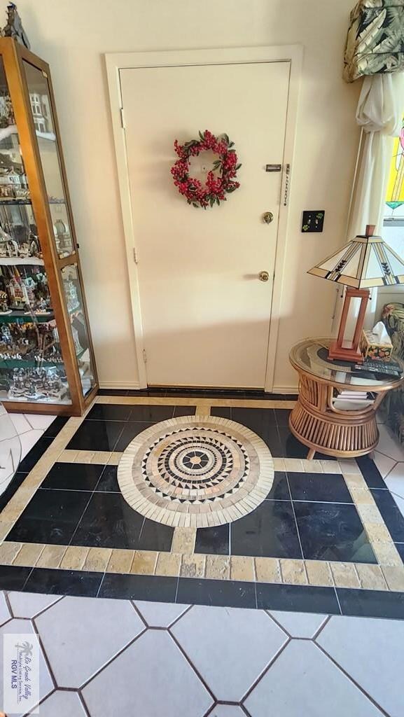 inlaid tile at entry