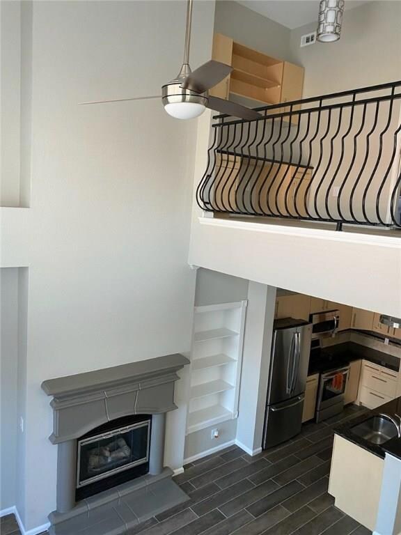 Stairs featuring wood finish floors, built in she