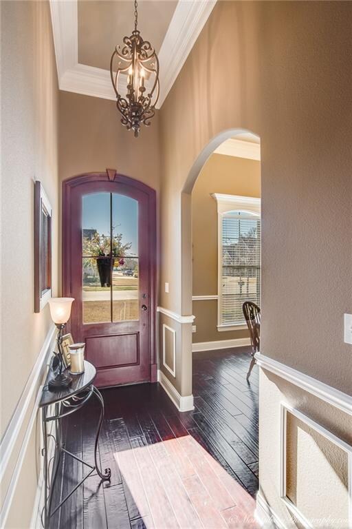 Elegant entry with hand scraped hardwood flooring,