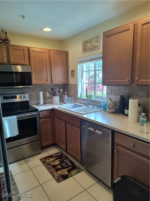 Kitchen with dishwashing machine, range, light cou