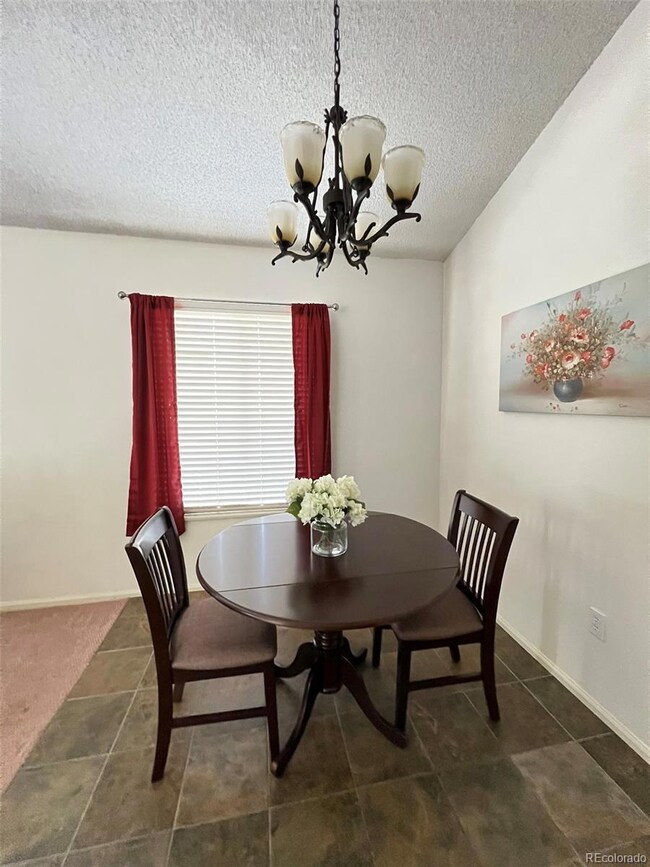 Dining room with ceramic slate tile