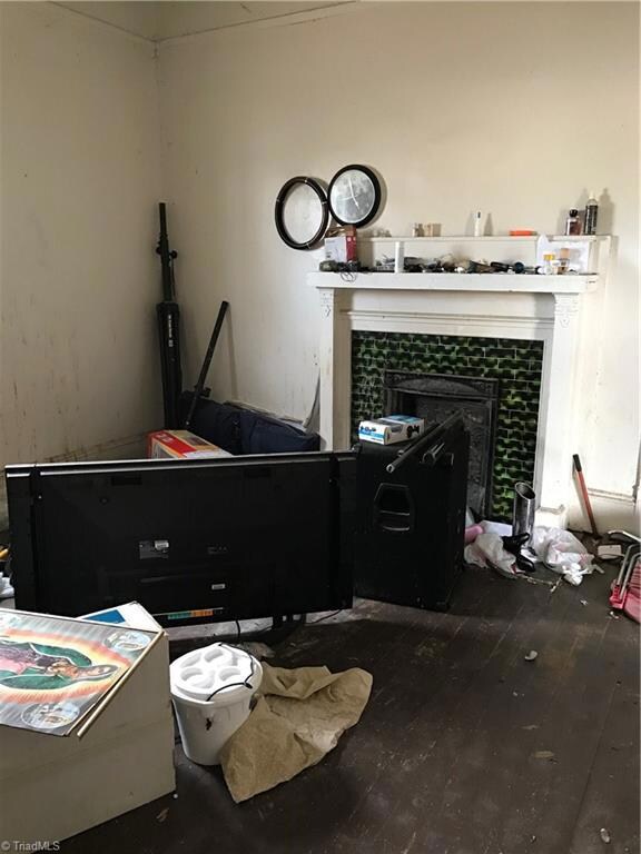 1 of 2 fireplaces, and hard wood floors, large windows