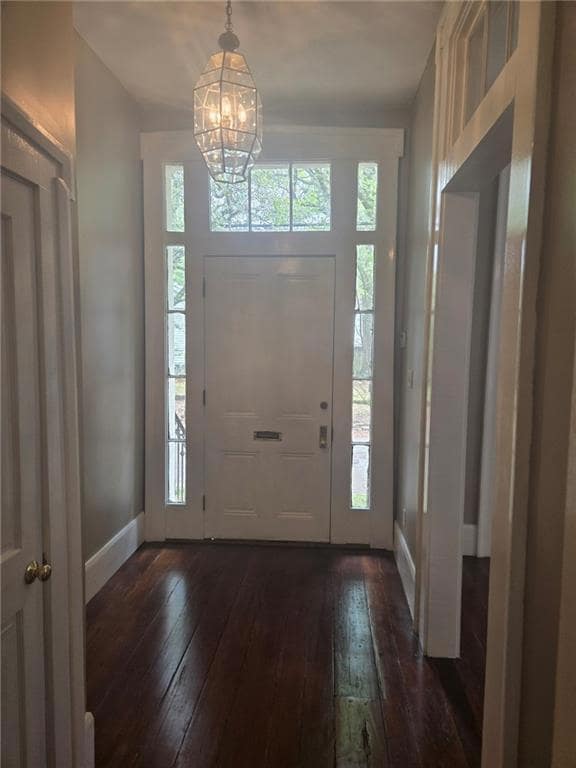 Unfurnished living room featuring ceiling fan, a t