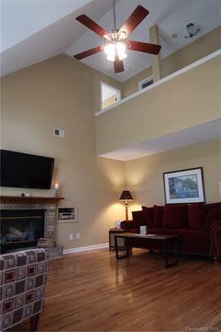 another view of the vaulted great room with hardwo