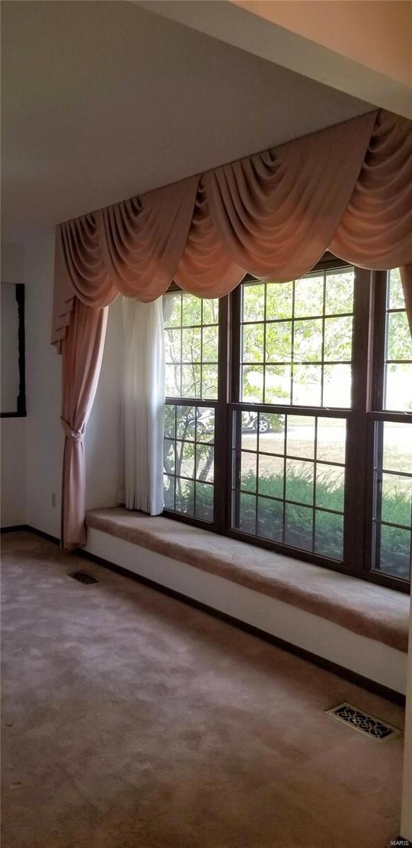 Large bay window with seating in the Living Room.