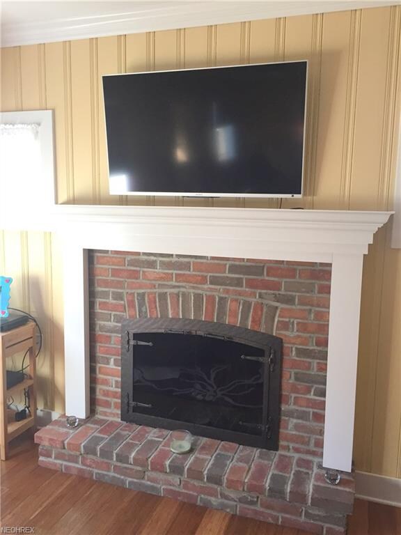 Wood burning fireplace and custom built mantle.