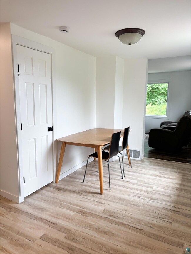 Dining area featuring light wood-style flooring