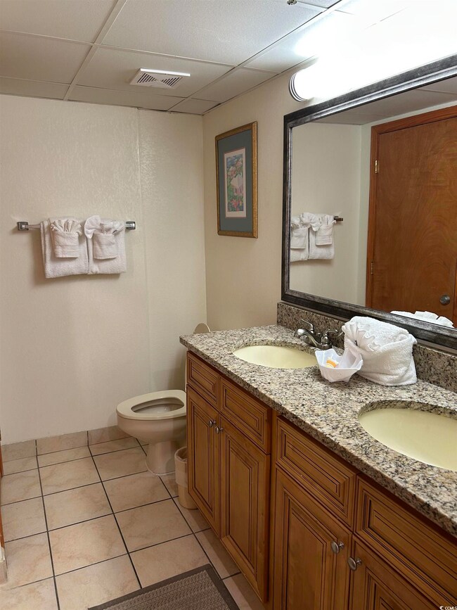 Bathroom featuring tile patterned floors, toilet, 