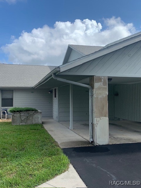 Front of unit with carport