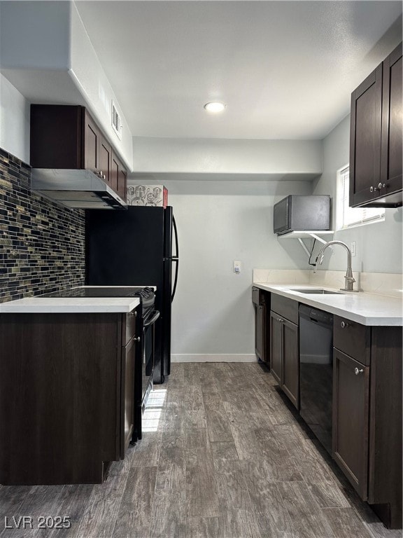 Kitchen with dishwasher, range hood, dark wood fin