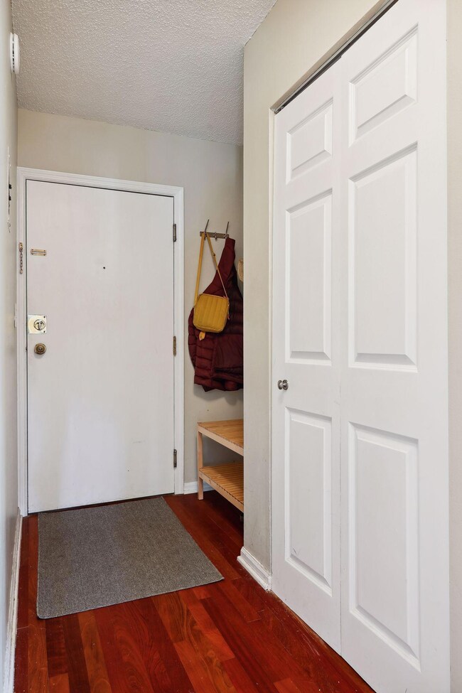 Front entryway has room for bench and includes nice storage closet for household items.