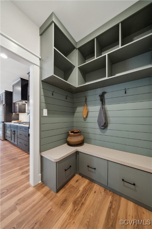 Mudroom with light wood-style flooring