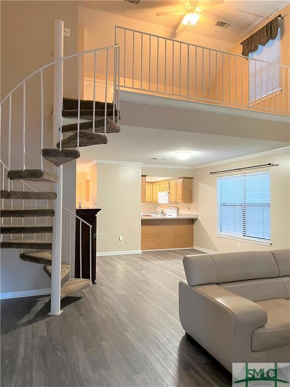 View from front showing spiral staircase to upstai