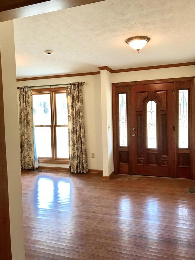 Foyer opens to dining