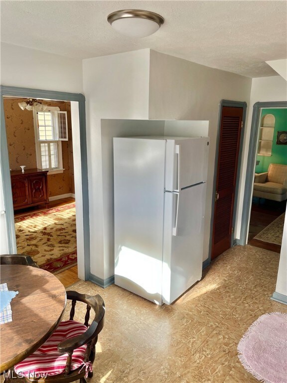 Kitchen with access to dining room and living room.