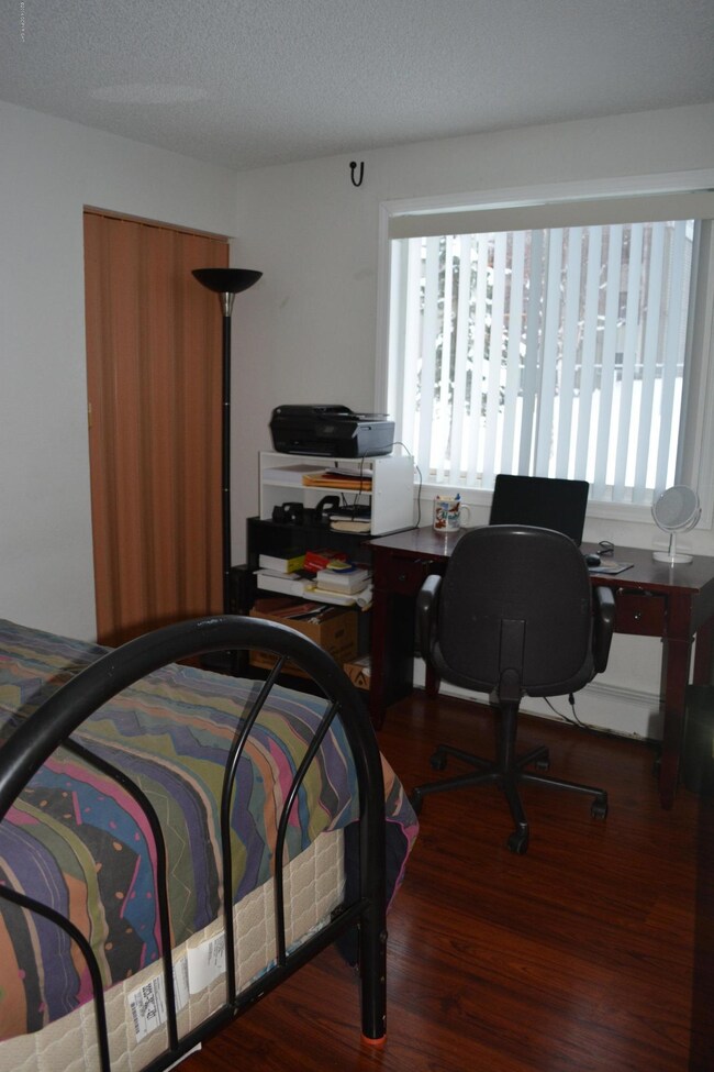 Middle bedroom with view of yard