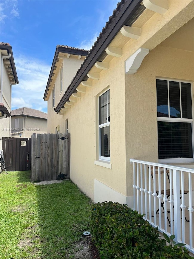 Entrance thru side gate on LEFT side of the proper