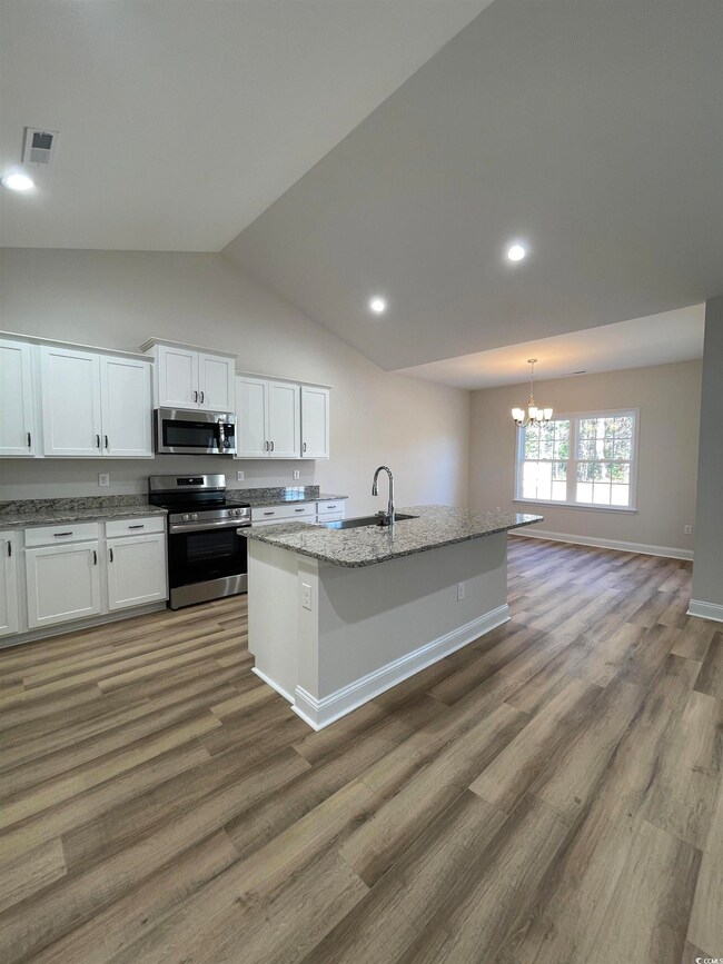 Kitchen with appliances with stainless steel finis