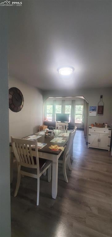 Dining area featuring wood finished floors
