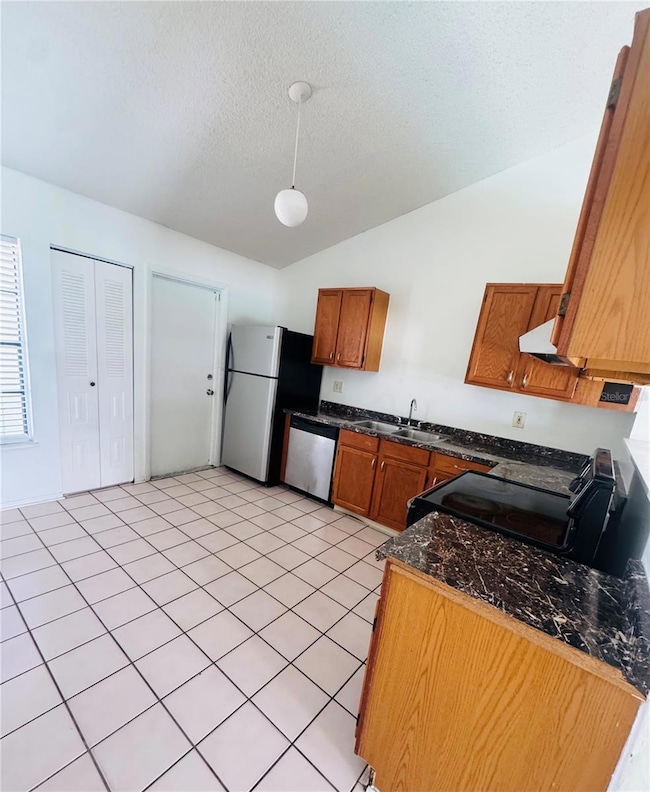 Looking in to the kitchen area towards the garage door.
