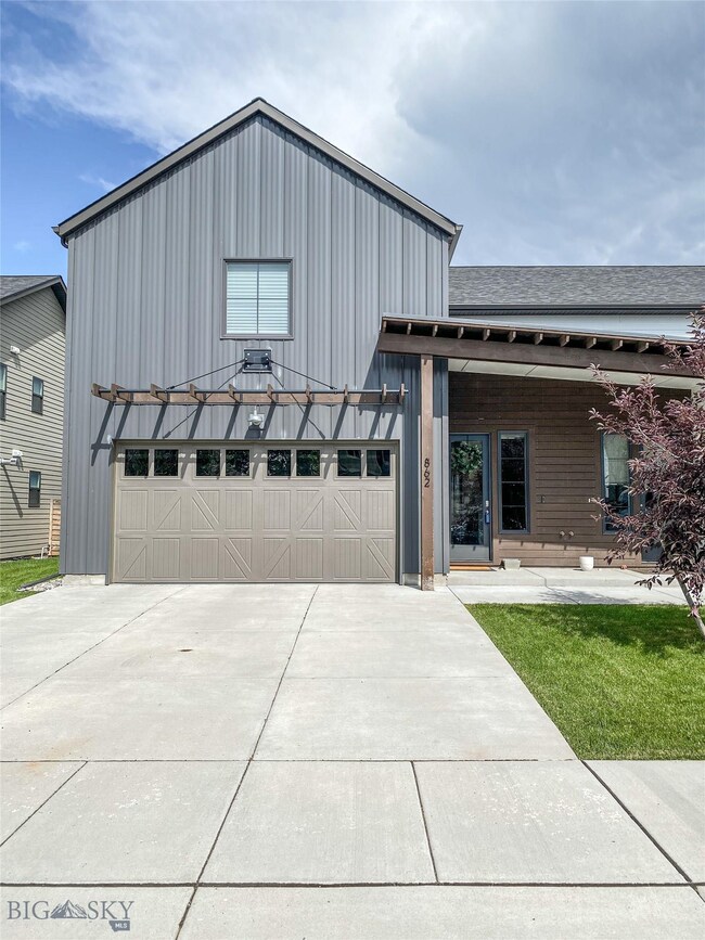 Street view including covered porch entry and doub
