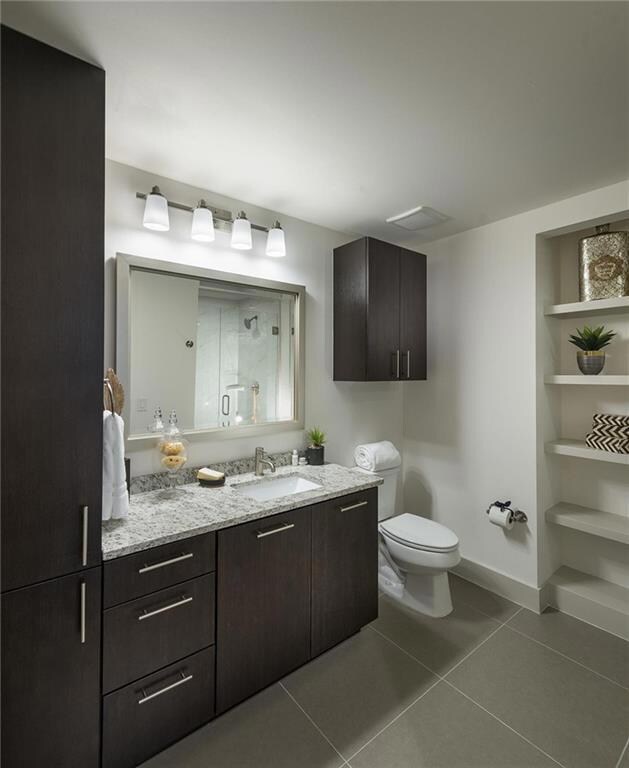 Bathroom featuring vanity, tile patterned floors, 