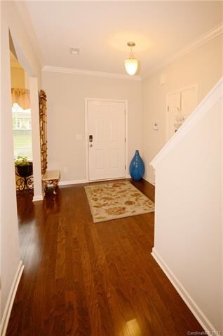 Foyer with Elegant Wood Floors.