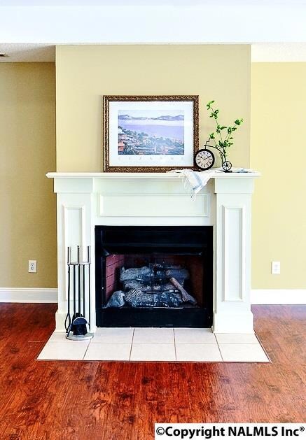 Another gorgeous feature of this home.  Ornate mantle and tile accents make this an eye-catching focal point.