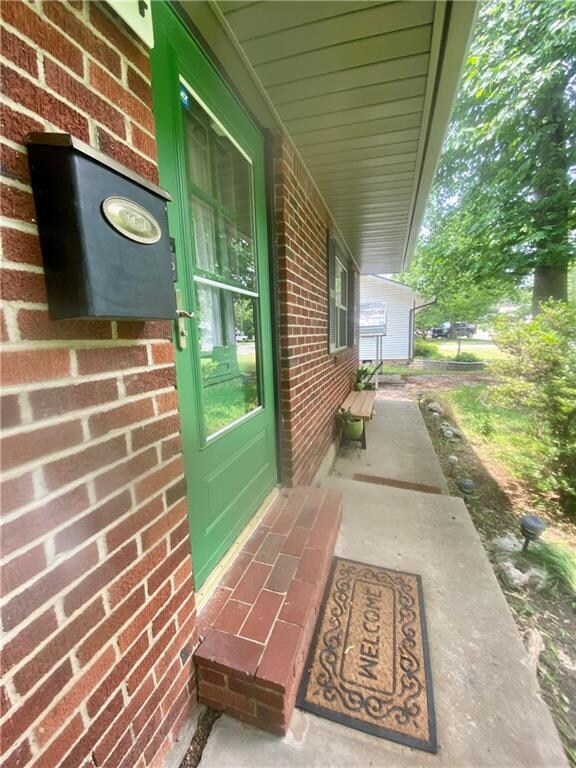 Sidewalk heading West & Front porch area