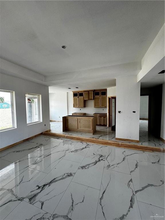 Unfurnished living room with light tile floors