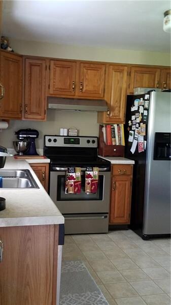 Kitchen with newer appliances and eat in area.