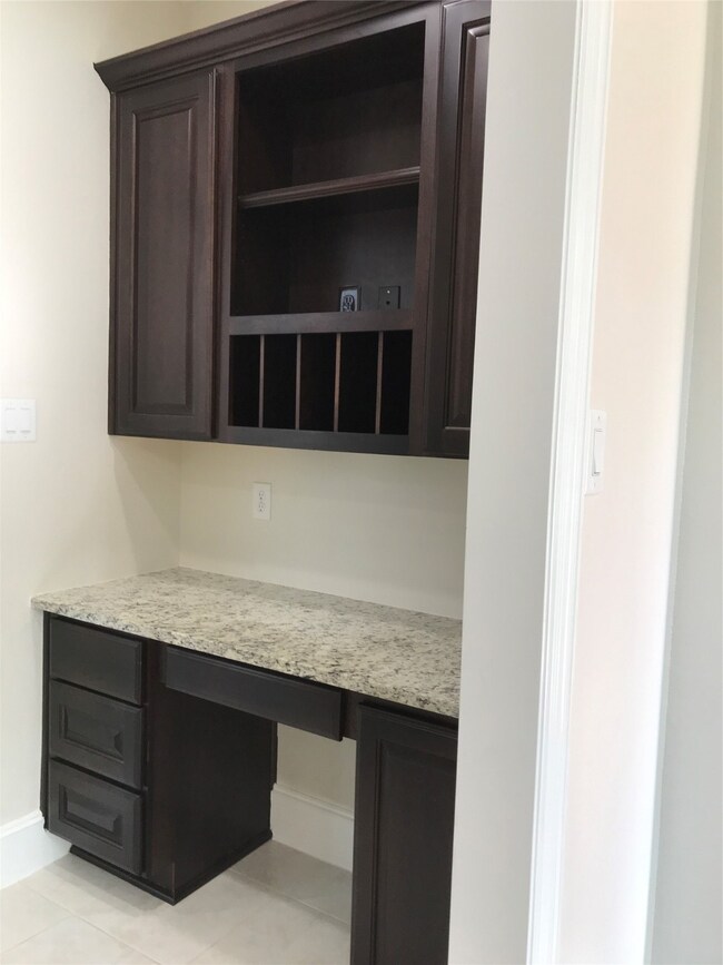 Desk area between kitchen and dining room