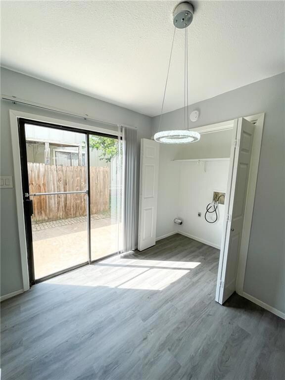 Unfurnished dining area with wood finished floors