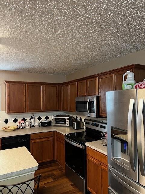 Kitchen with dishwashing machine, dark wood-type f
