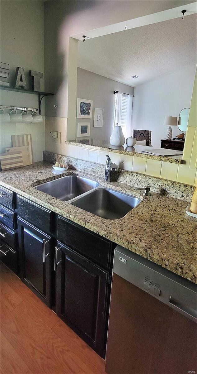Kitchen with open bar to living room