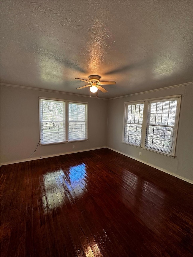 Spare room featuring a textured ceiling, ceiling f