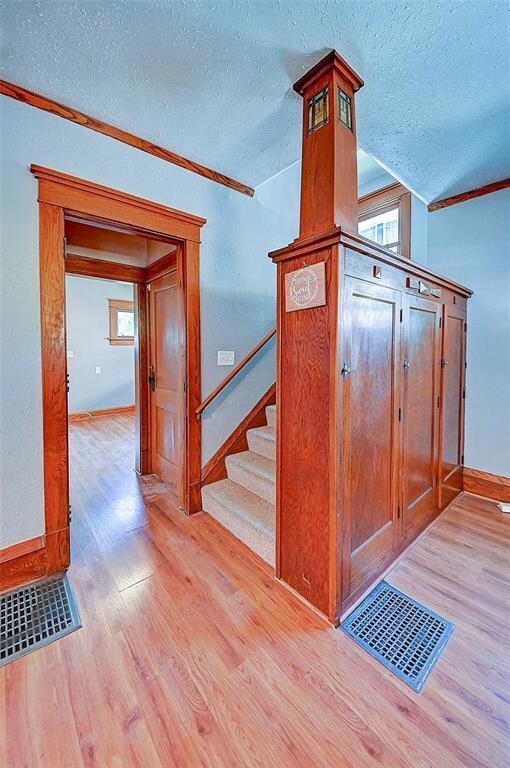 Either go upstairs or through to the kitchen right
