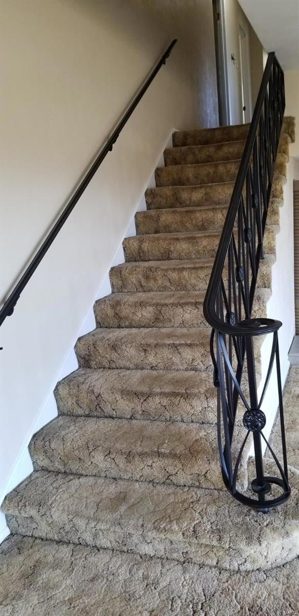 Stairs lead to full bath and 3 bedrooms/office areas.