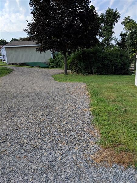 Enough parking behind the house for 4 cars and a s