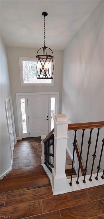 Foyer and steps with custom iron railing. New fron