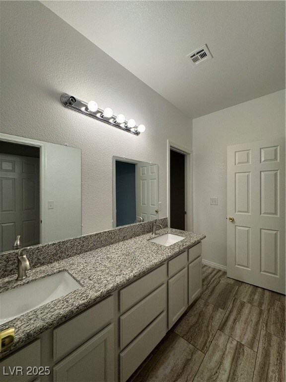 Full bath featuring wood finished floors, visible