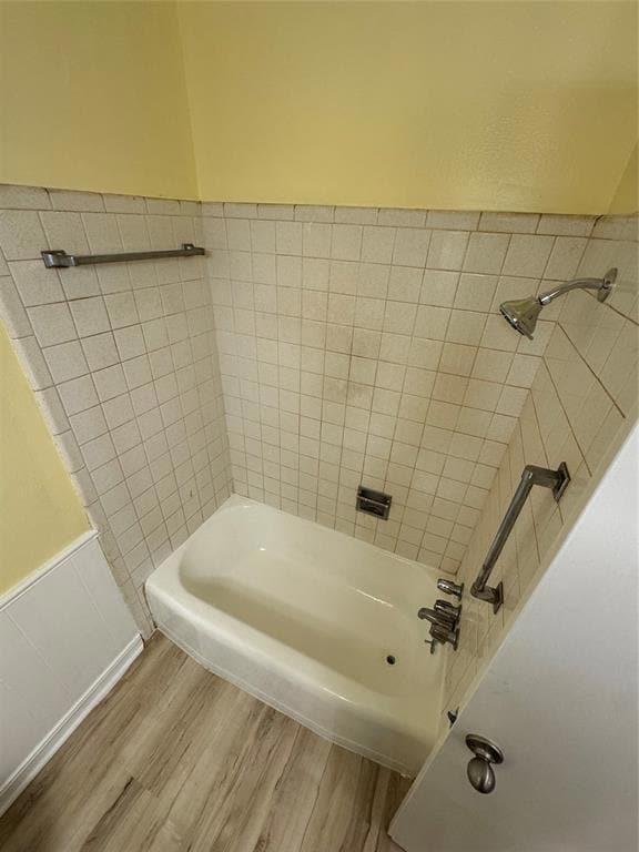 Full bath featuring wood finished floors