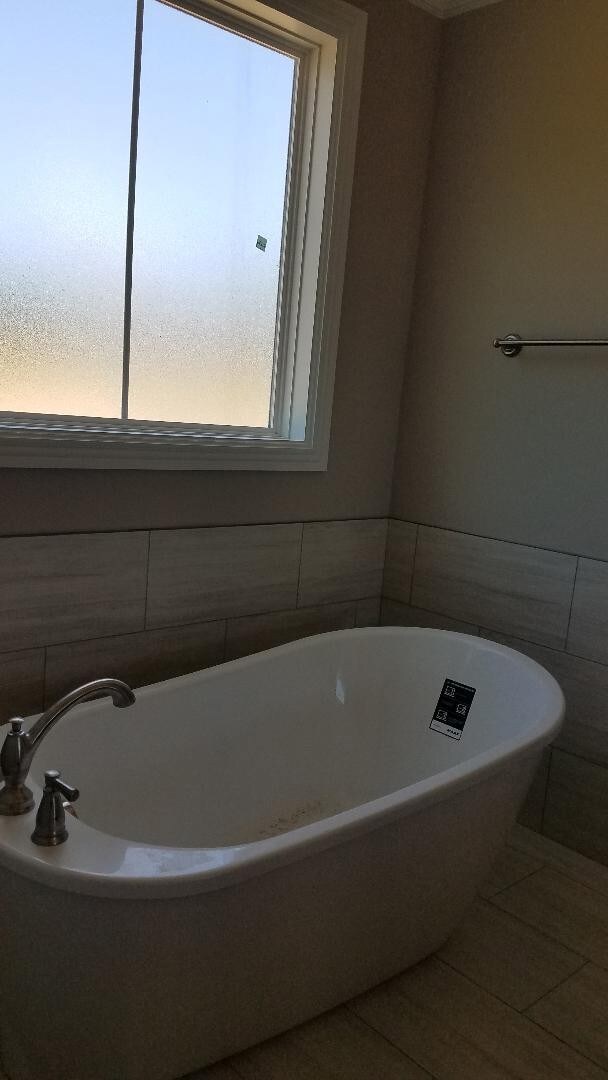 Elegant free-standing tub in master suite.