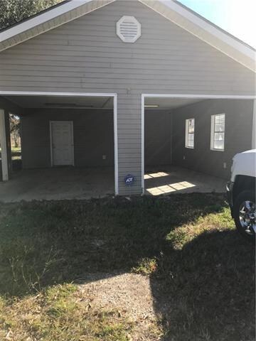 Two car garage with work shop and storage room