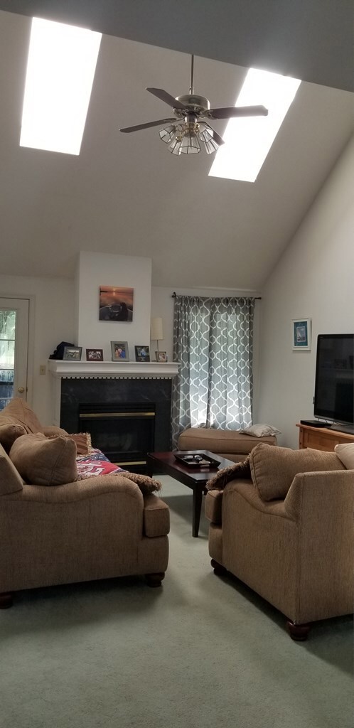 Light floods the living room from the skylights in
